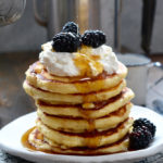 Bourbon Barrel Aged Maple Syrup Pancakes with Whipped Cream and Blackberries ciaochowbambina.com