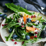 Wintery Greens with Avocado, Berries, Pistachios and Tahini Dressing