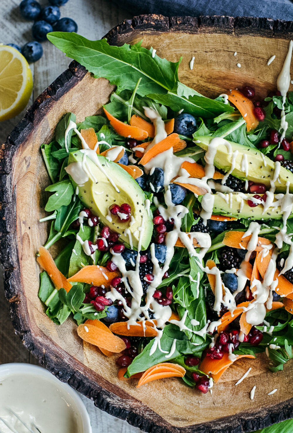 Wintery Greens with Avocado, Berries, Pistachios and Tahini Dressing